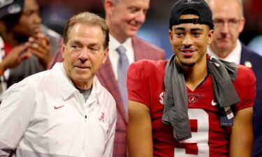 Alabama head coach Nick Saban (eft) and Bryce Young #9 celebrate their win against the Georgia Bulldogs in the SEC Championship game at Mercedes-Benz Stadium on December 4 in Atlanta