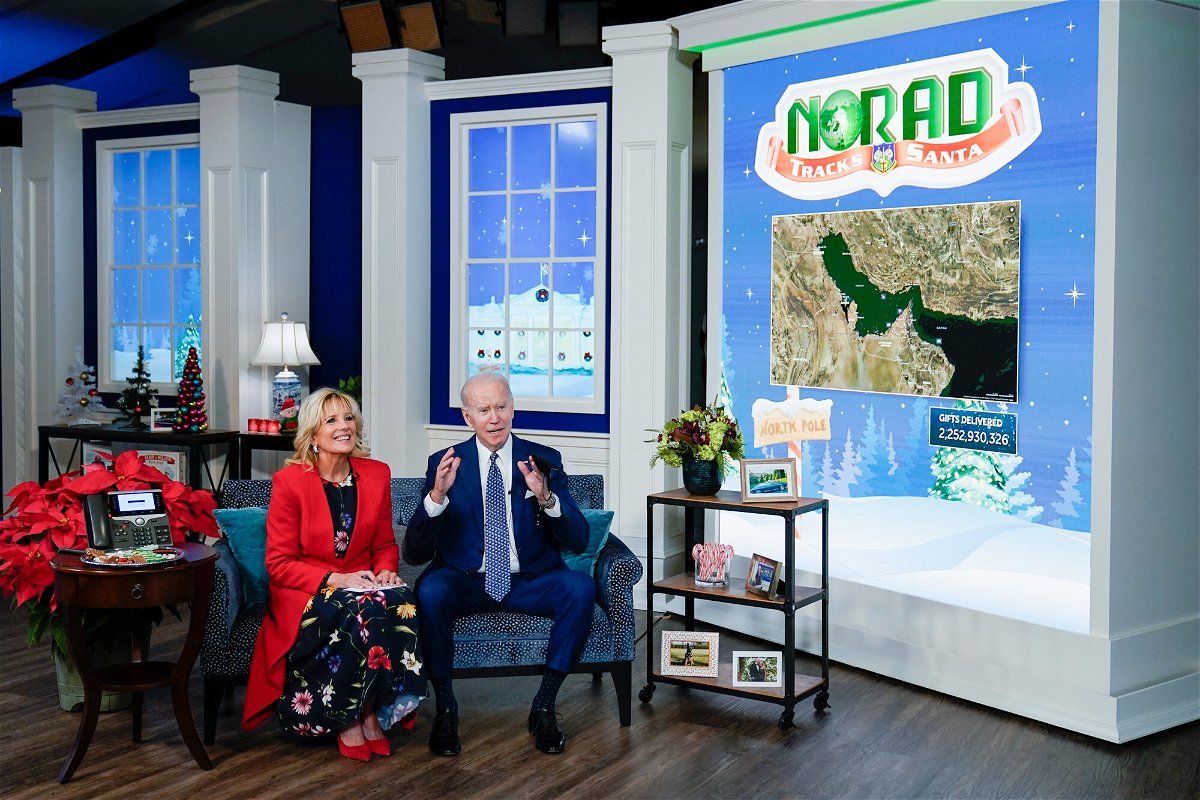 <i>Carolyn Kaster/AP</i><br/>President Joe Biden and first lady Jill Biden speak with the NORAD Tracks Santa Operations Center on Friday