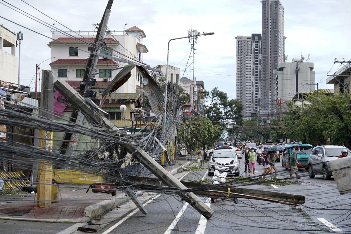 <i>Jay Labra/AP</i><br/>Toppled electrical posts lie along a street in Cebu city