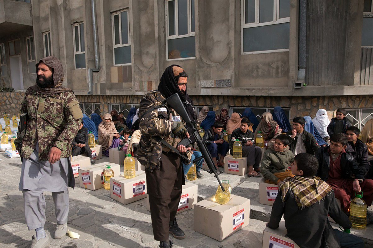 <i>Bilal Guler/Anadolu Agency/Getty Images</i><br/>Turkey's Disaster and Emergency Management Presidency provides food aid to Afghan families in Kabul on December 7.