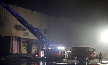 Firefighters work on cleanup after a fire ripped through a distribution center for the QVC home shopping television network in Rocky Mount