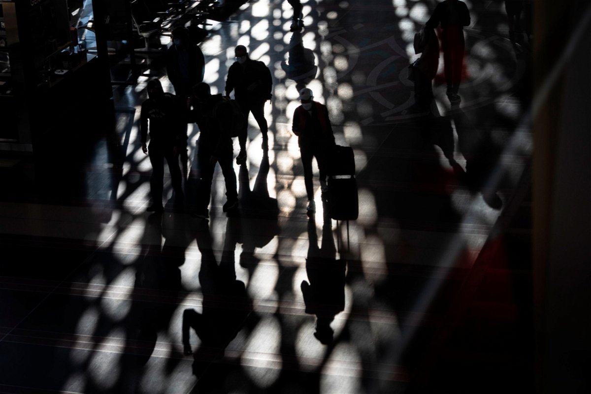 <i>Drew Angerer/Getty Images</i><br/>Travelers walk through the main concourse at Reagan National Airport in Arlington