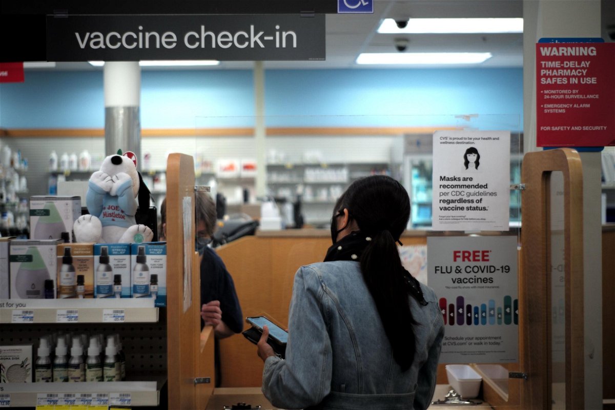 <i>Wu Xiaoling/Xinhua/Getty Images</i><br/>Changing the definition of 'fully vaccinated' to include a third dose of vaccine could be difficult. A woman here waits for the Covid-19 booster vaccine in Burlingame