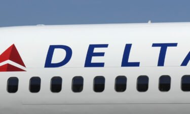 A Boeing 757 with a new Delta Airlines logo sits on the tarmac following the company's emergence from bankruptcy at Hartsfield Jackson International Airport April 30