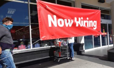 A key unemployment measure hasn't been this low in 52 years. A Now Hiring sign hangs in front of a Winn-Dixie grocery store on December 03 in Miami