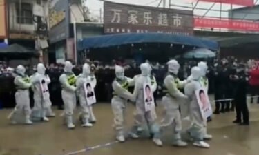 Chinese police parade human smuggling suspects in public to shame them for violating pandemic rules.
