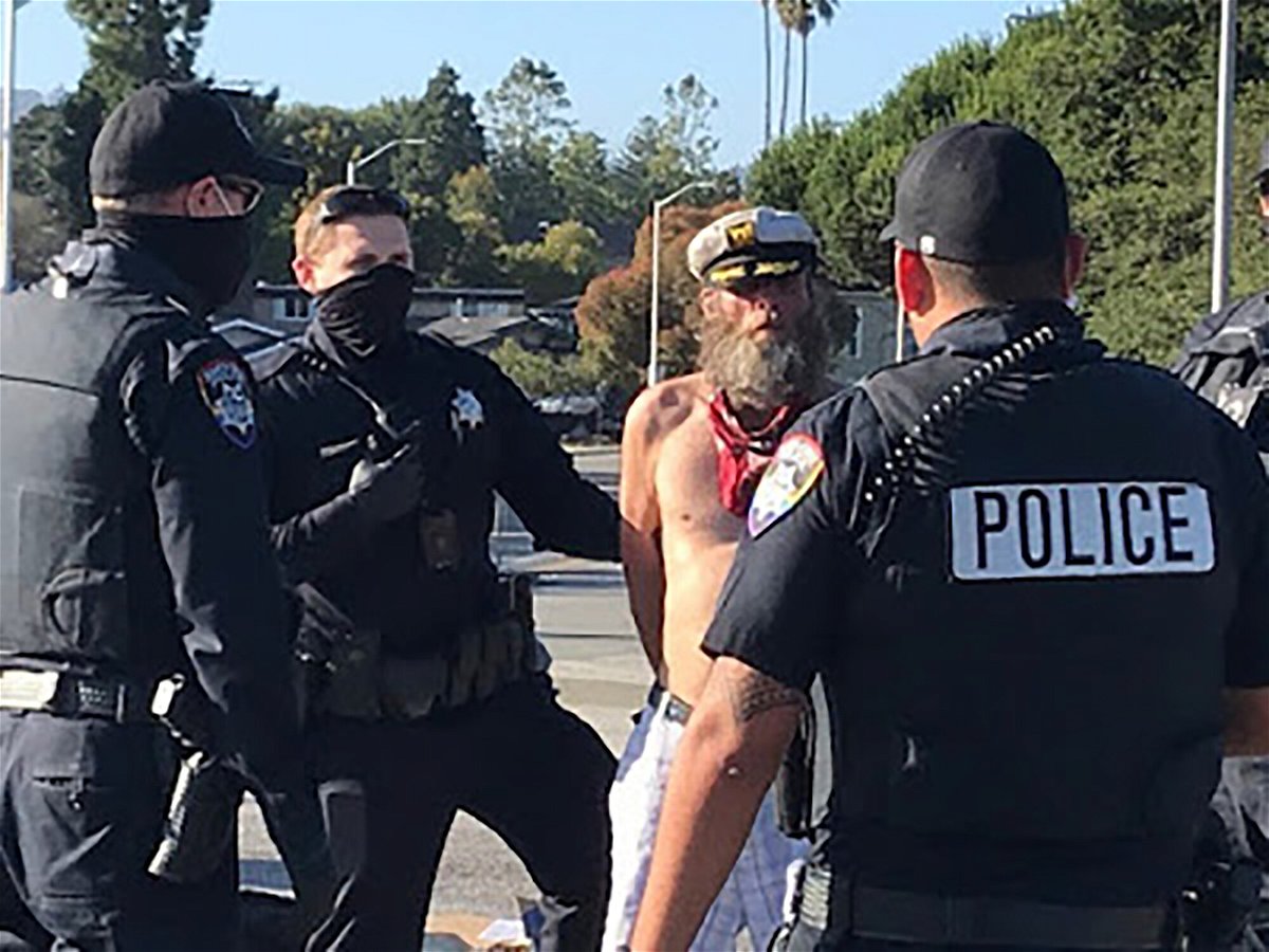 <i>Santa Cruz Police Department/AP</i><br/>This photo provided by the Santa Cruz Police Department shows Ole Hougen being taken into custody by police officers in Santa Cruz