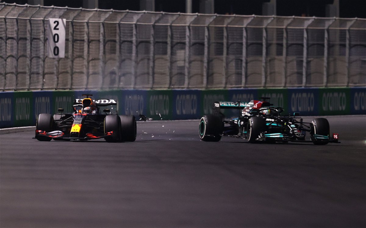 <i>Lars Baron/Getty Images Europe/Getty Images</i><br/>Max Verstappen of the Netherlands driving the (33) Red Bull Racing RB16B Honda and Lewis Hamilton of Great Britain driving the (44) Mercedes AMG Petronas F1 Team Mercedes W12 collide during the F1 Grand Prix of Saudi Arabia at Jeddah Corniche Circuit on December 05