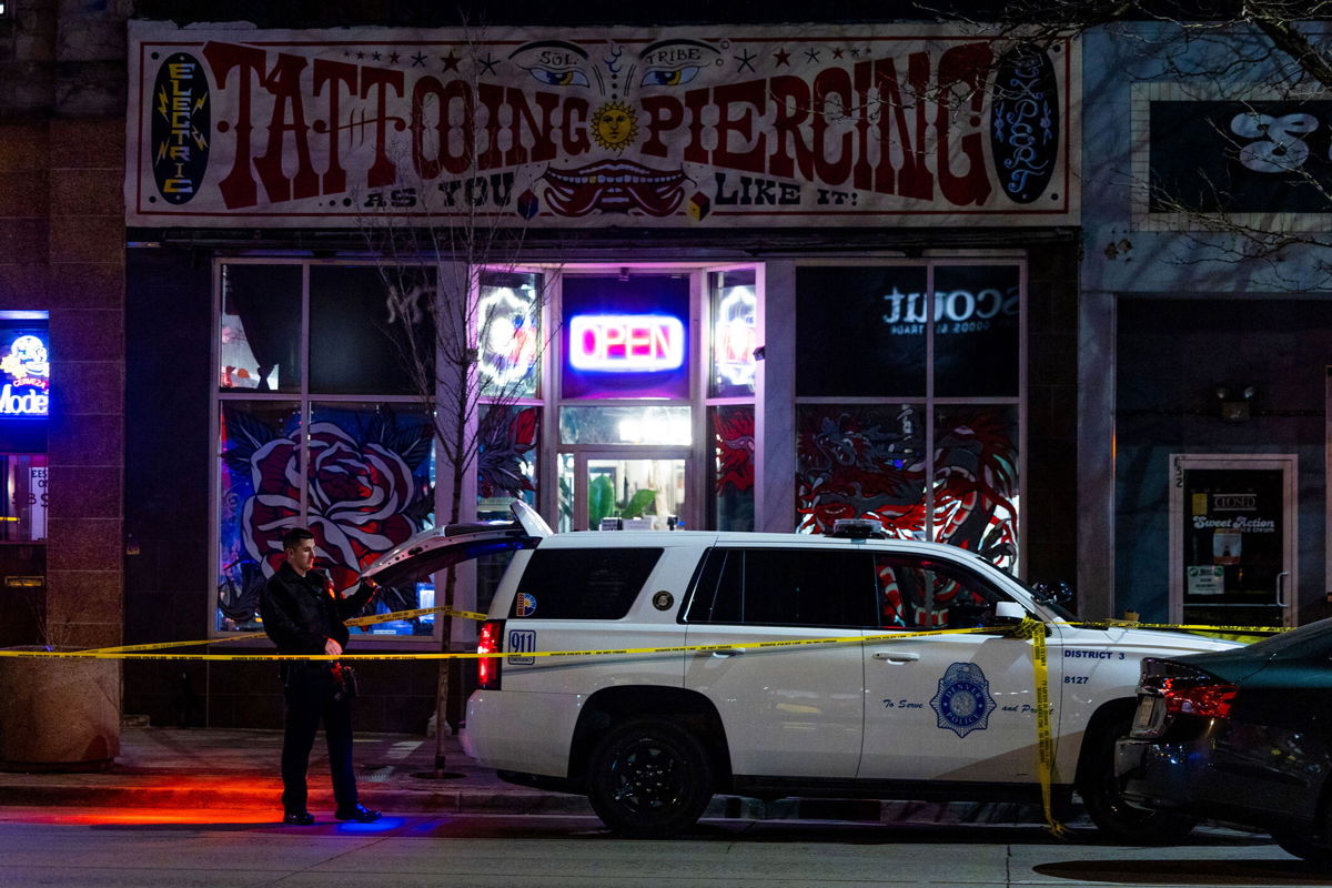 <i>Michael Ciaglo/Getty Images</i><br/>Police investigate after two women were killed and a man was injured December 27 in shootings around Denver.