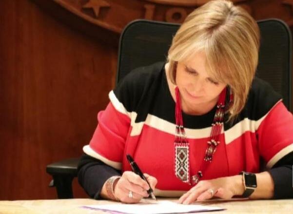 New Mexico Gov. Michelle Lujan Grisham signs a redistricting measure into law.