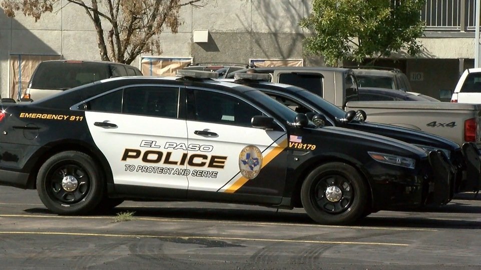 El Paso police vehicles sit outside a residence where a baby died.