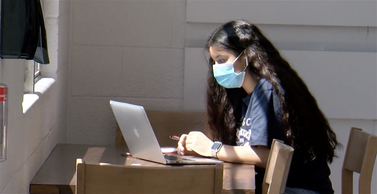 A student wearing a mask.