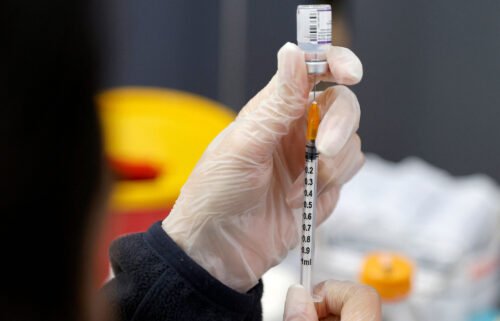 A medic prepares a dose of the Pfizer-BioNTech vaccine against the coronavirus at a private nursing home in the Israeli central coastal city of Netanya on January 5