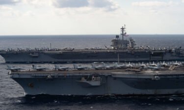 The pilot of a US F-35 jet ejected as his jet crashed on the deck of the USS Carl Vinson aircraft carrier in the South China Sea injuring seven