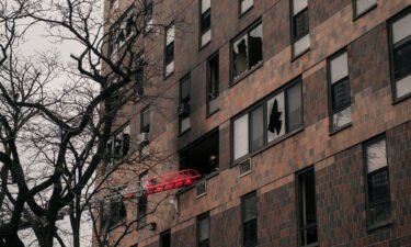 Soot and broken windows at the apartment building where a fire killed 17 people in the Bronx borough of New York City.