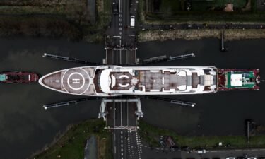 Incredible pictures show a superyacht seemingly scraping under low bridges - with 12 cm clearance. Dutch shipbuilders Heesen were tasked with transporting the 80m boat MY Galactica from its shed in Oss to the North Sea.