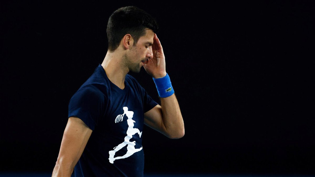 <i>Daniel Pockett/Getty Images</i><br/>Novak Djokovic of Serbia reacts during a practice session ahead of the 2022 Australian Open at Melbourne Park on January 14