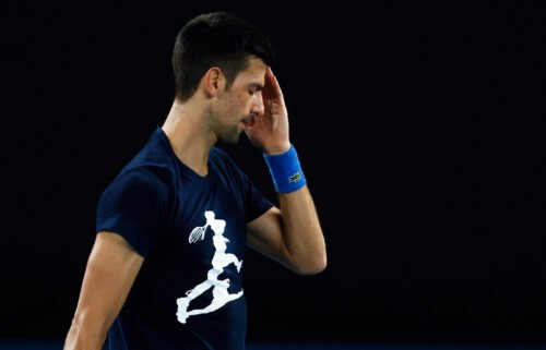 Novak Djokovic of Serbia reacts during a practice session ahead of the 2022 Australian Open at Melbourne Park on January 14