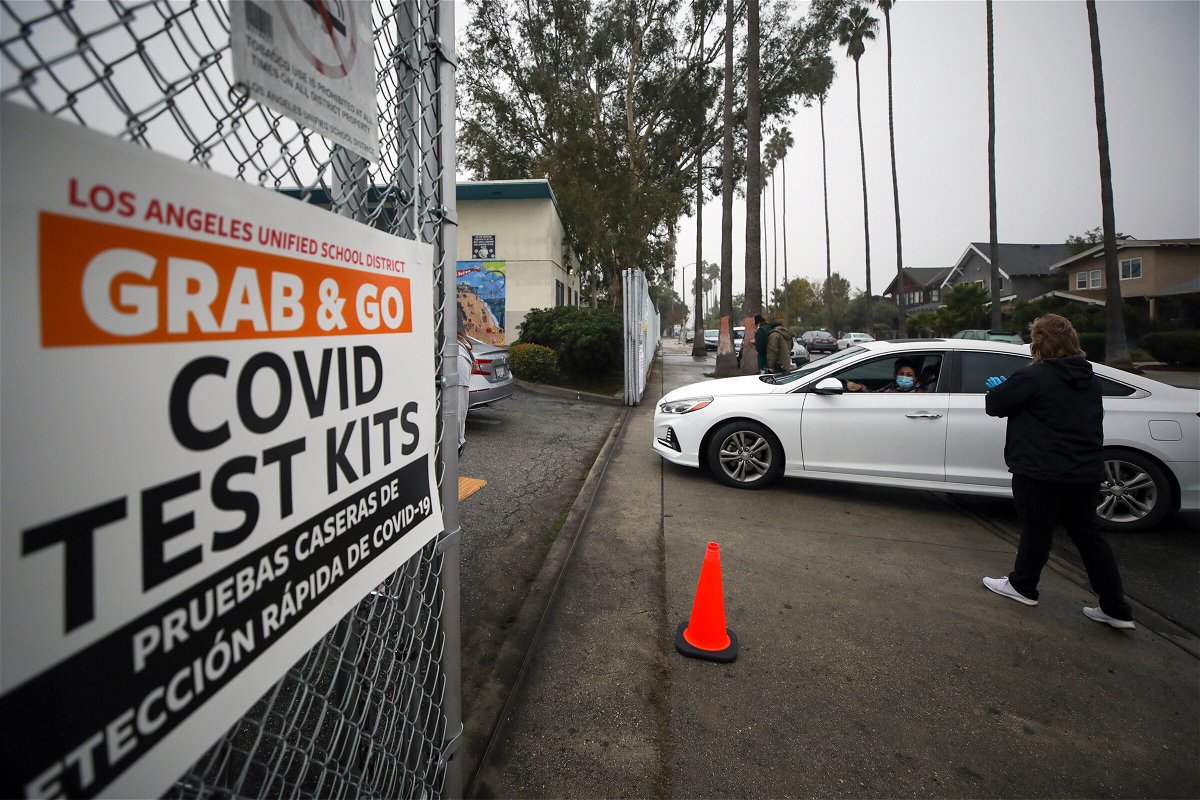 <i>Irfan Khan/Los Angeles Times/Getty Images</i><br/>Los Angeles Unified School District staff distribute free Covid-19 test kits to local families on Friday