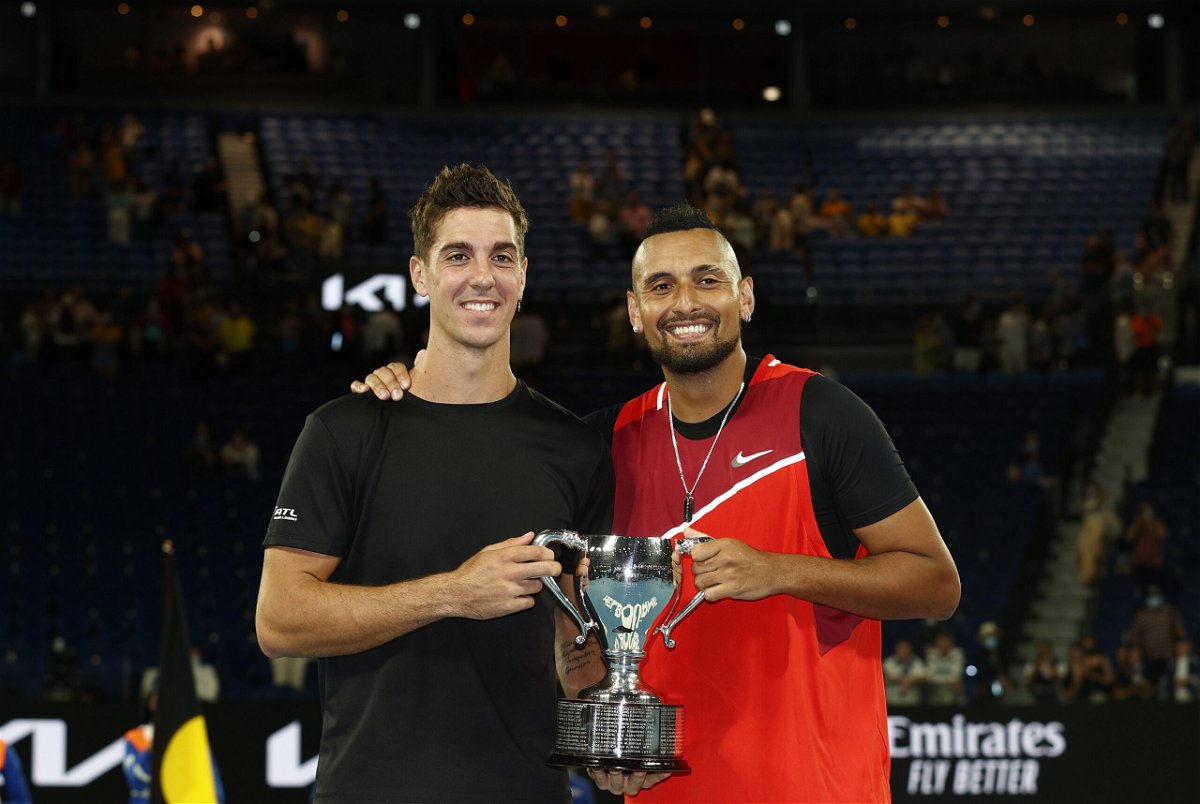 <i>Darrian Traynor/Getty Images</i><br/>Thanasi Kokkinakis and Nick Kyrgios pose with the championship trophy after winning their men's doubles final.
