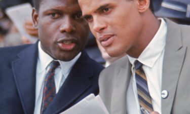 Actor Sidney Poitier and singer Harry Belafonte chat during the March on Washington for Jobs and Freedom in Washington