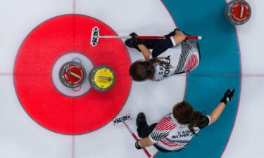 South Korea's Kim Seonyeong and Kim Yeongmi compete during the curling women's gold medal game between South Korea and Sweden during the Pyeongchang 2018 Winter Olympics.