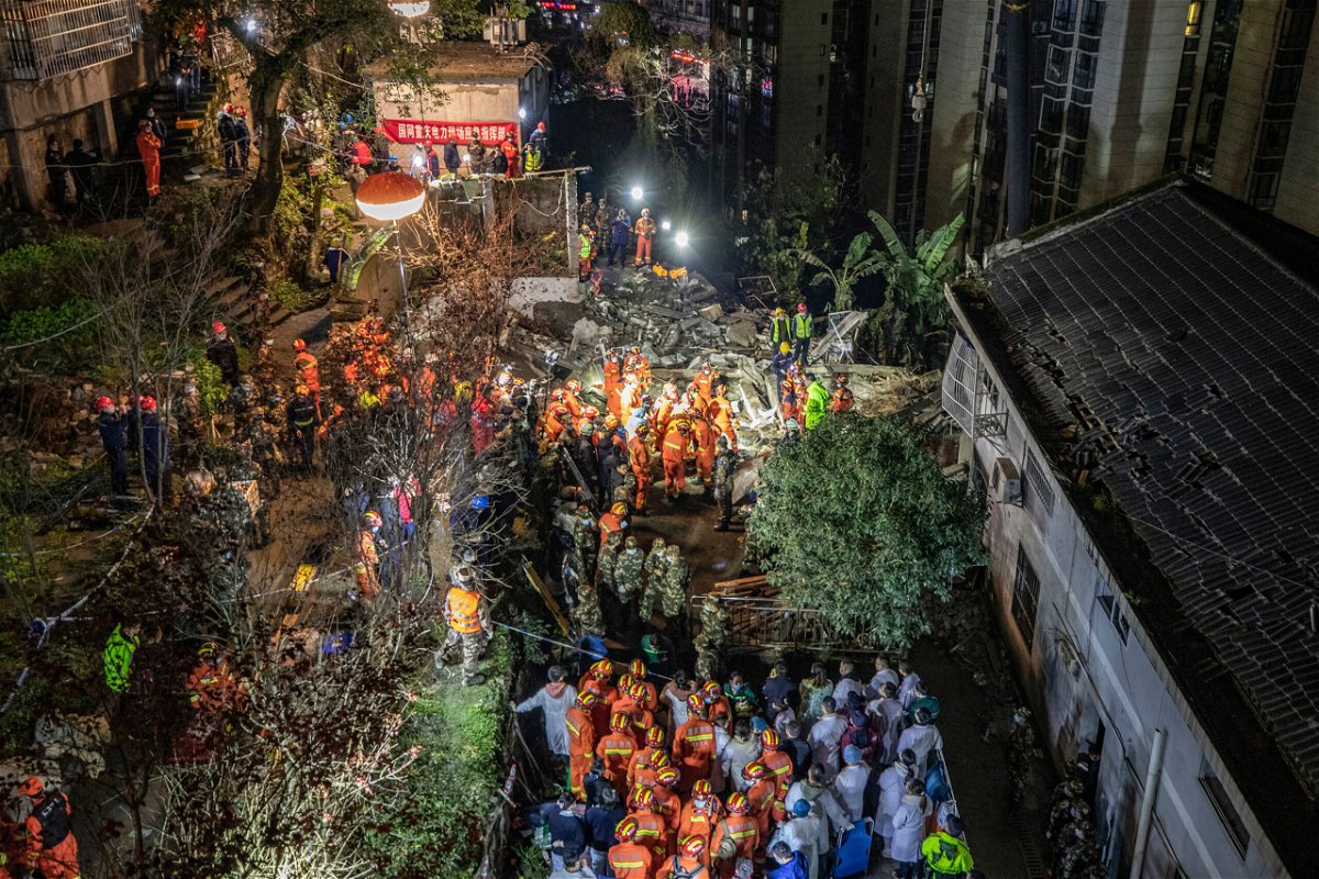 <i>AFP/Getty Images</i><br/>Rescuers search at the scene of the explosion in Chongqing