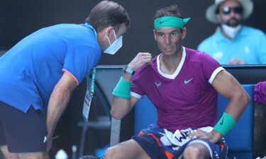 Rafael Nadal receives attention during a medical time out in his quarterfinal match against Denis Shapovalov.