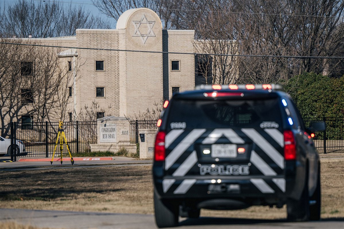 <i>Brandon Bell/Getty Images</i><br/>A law enforcement vehicle sits near the Congregation Beth Israel synagogue on January 16 in Colleyville