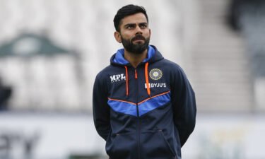 Virat Kohli looks on as the India team warms up ahead of the fourth day of the second Test cricket match between South Africa and India in Johannesburg on January 6