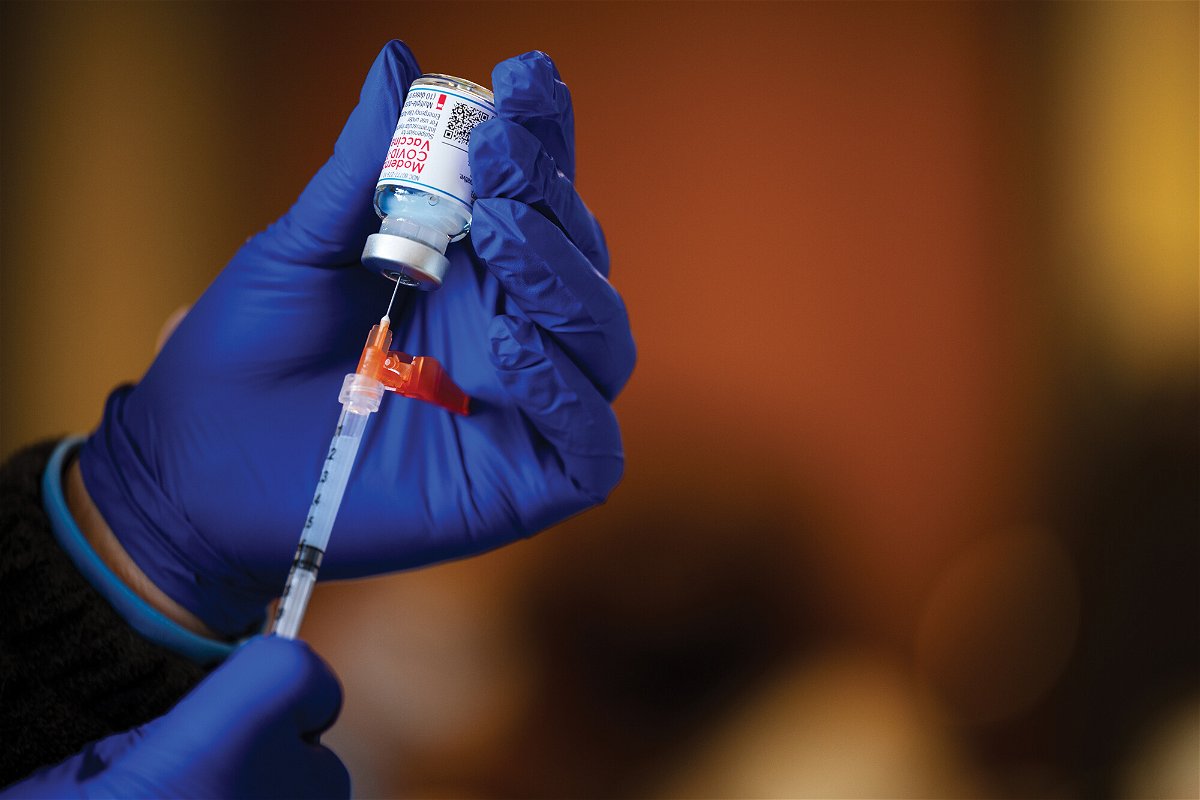 <i>Jon Cherry/Getty Images</i><br/>A medical technician fills a syringe from a vial of the Moderna COVID-19 vaccine in Bates Memorial Baptist Church February 12