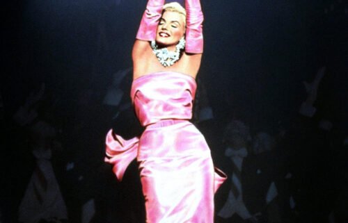 The pink satin gown has been widely imitated since it's creation in the early 1950s.
