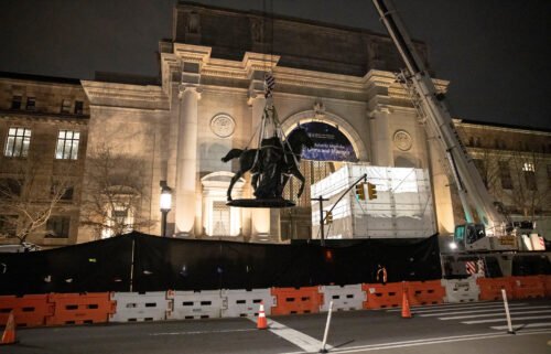 Workers remove part of a statue of Theodore Roosevelt that had stood outside the entrance to the American Museum of Natural History since 1940.