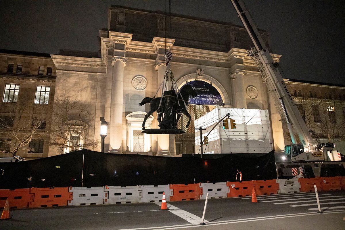 <i>Caitlin Ochs/Reuters</i><br/>Workers remove part of a statue of Theodore Roosevelt that had stood outside the entrance to the American Museum of Natural History since 1940.