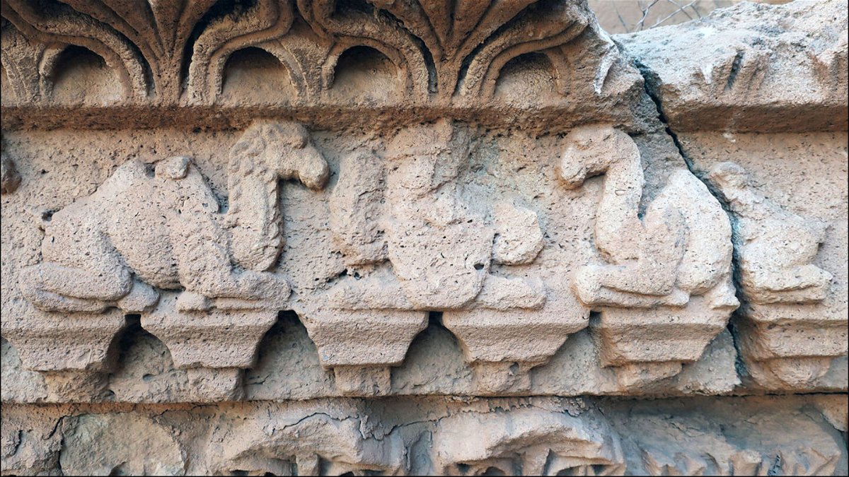 <i>Antiquity Publications Ltd/Aliph-ISMEO project at Hatra</i><br/>Artwork on a temple in northern Iraq depicts hybrid camels flanking a royal figure.