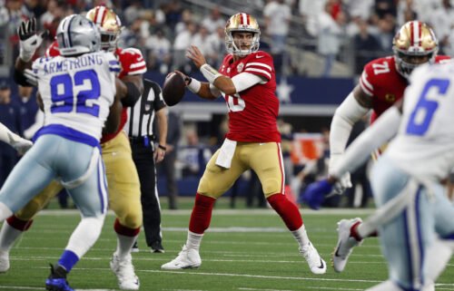 49ers QB Jimmy Garoppolo looking to pass against the Dallas Cowboys.