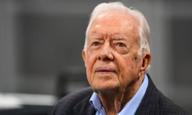 Former president Jimmy Carter prior to the game between the Atlanta Falcons and the Cincinnati Bengals at Mercedes-Benz Stadium on September 30