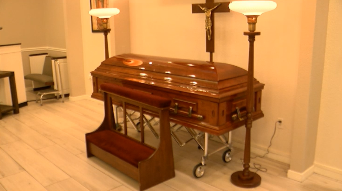 An empty casket on display at Sunset Funeral Home in west El Paso.