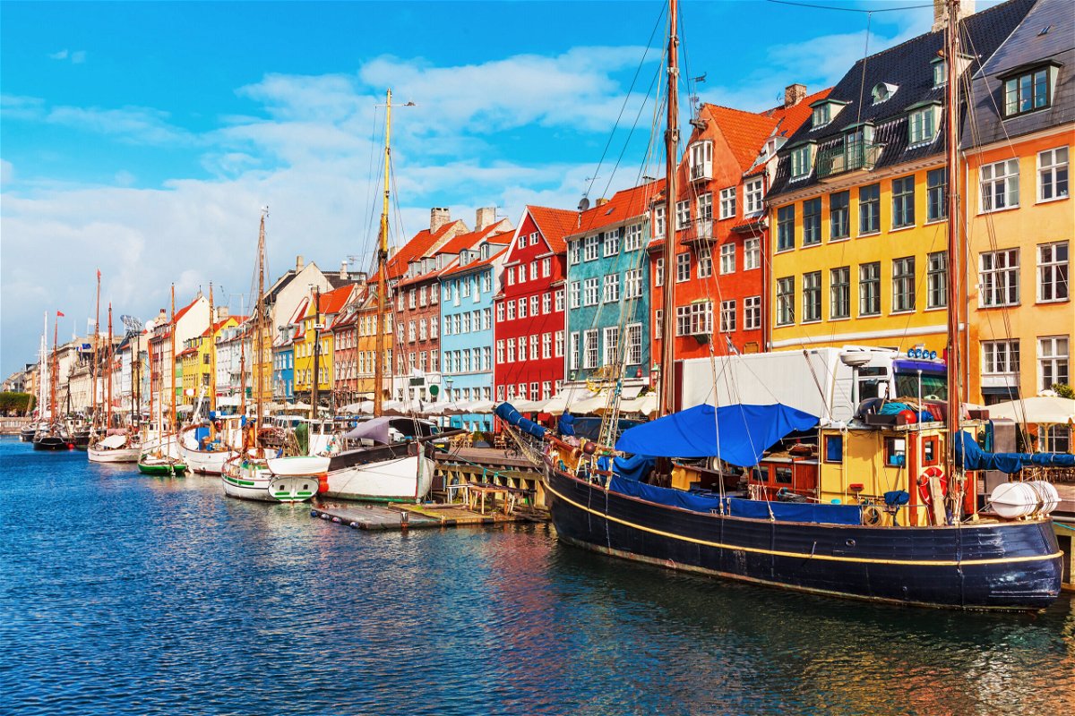 <i>Scanrail/Adobe Stock</i><br/>Scenic view of Nyhavn pier in the Old Town of Copenhagen