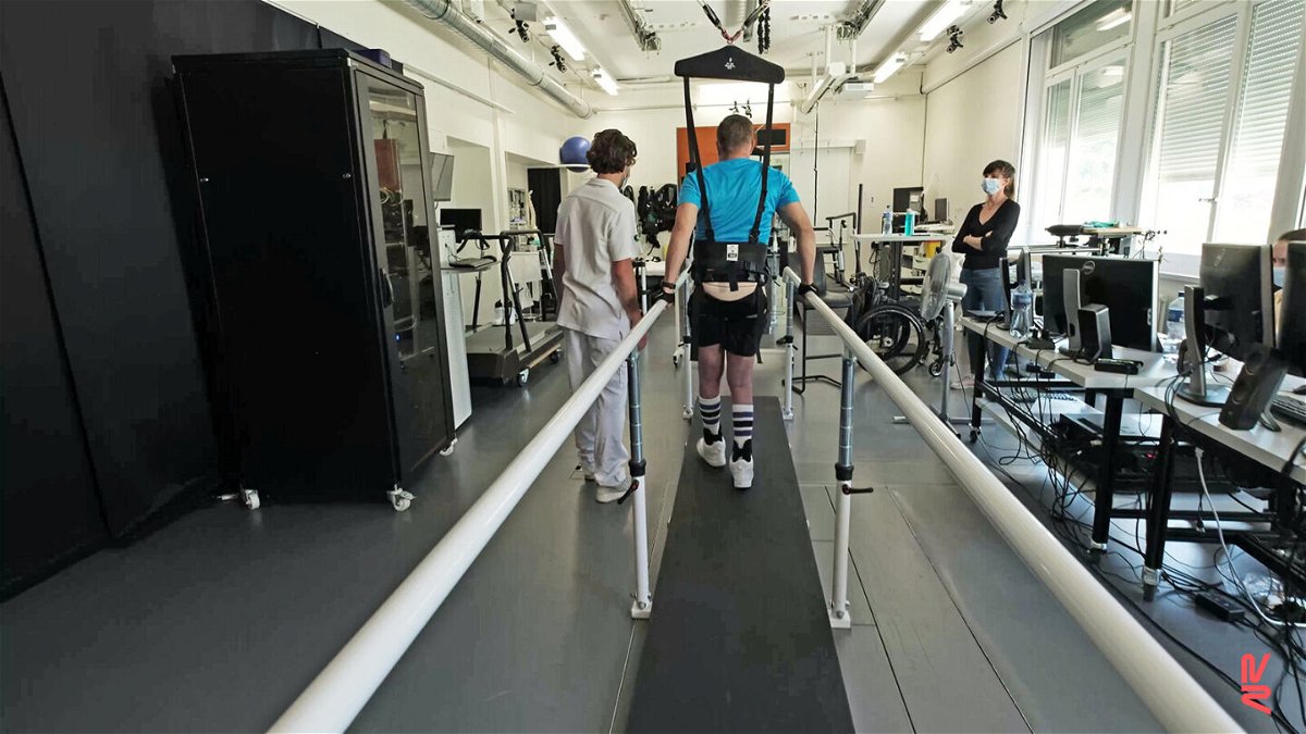 <i>Jimmy Ravier/NeuroRestore</i><br/>A 42-years-old patient performs training on a weight-supporting robot after having received a spinal cord implant within the STIMO Bridge research. He had been unable to move his legs for 1 year before he entered the project.