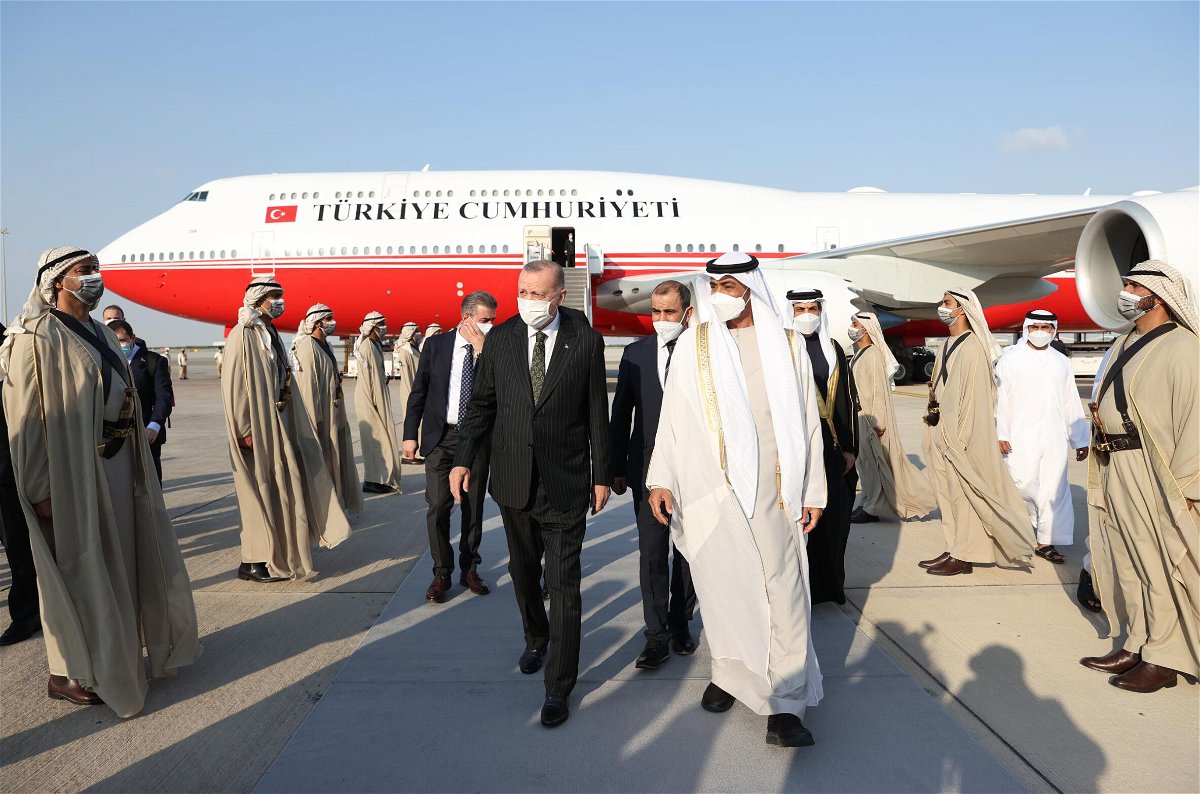 <i>Murat Kula/Anadolu Agency/Getty Images</i><br/>Turkish President Recep Tayyip Erdogan (L) is welcomed by Emirati officials after arriving at Abu Dhabi's international airport Monday.