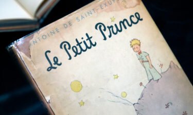 A French version of "The Little Prince" is seen on display at the Museum of Decorative Arts in Paris.