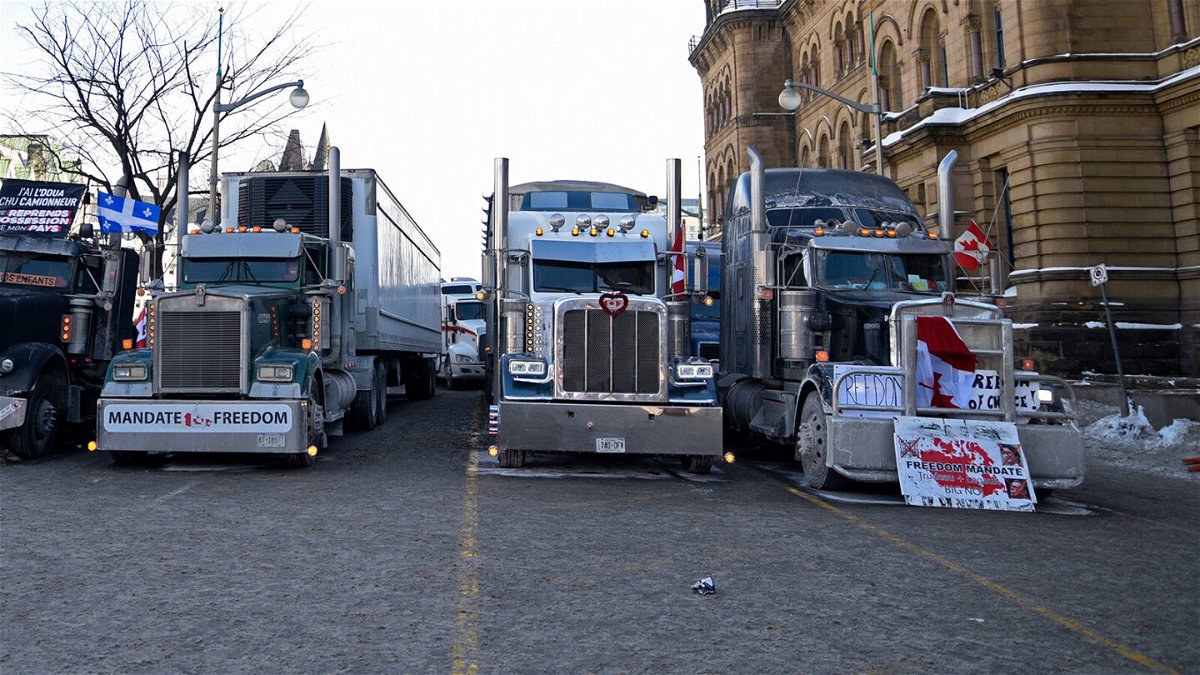 <i>Arindam Shivaani/NurPhoto/Getty Images</i><br/>Protesters have lined their trucks lined up next to the Parliament building in Ottawa.