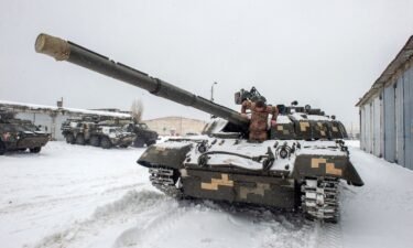 An Ukrainian Military Forces serviceman exits from a tank of the 92nd separate mechanized brigade of Ukrainian Armed Forces
