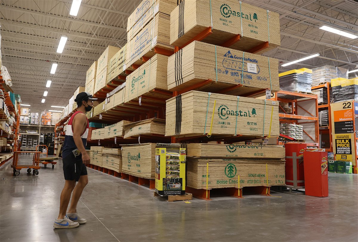 <i>Joe Raedle/Getty Images</i><br/>A customer walks past plywood for sale at a Home Depot store on May 27