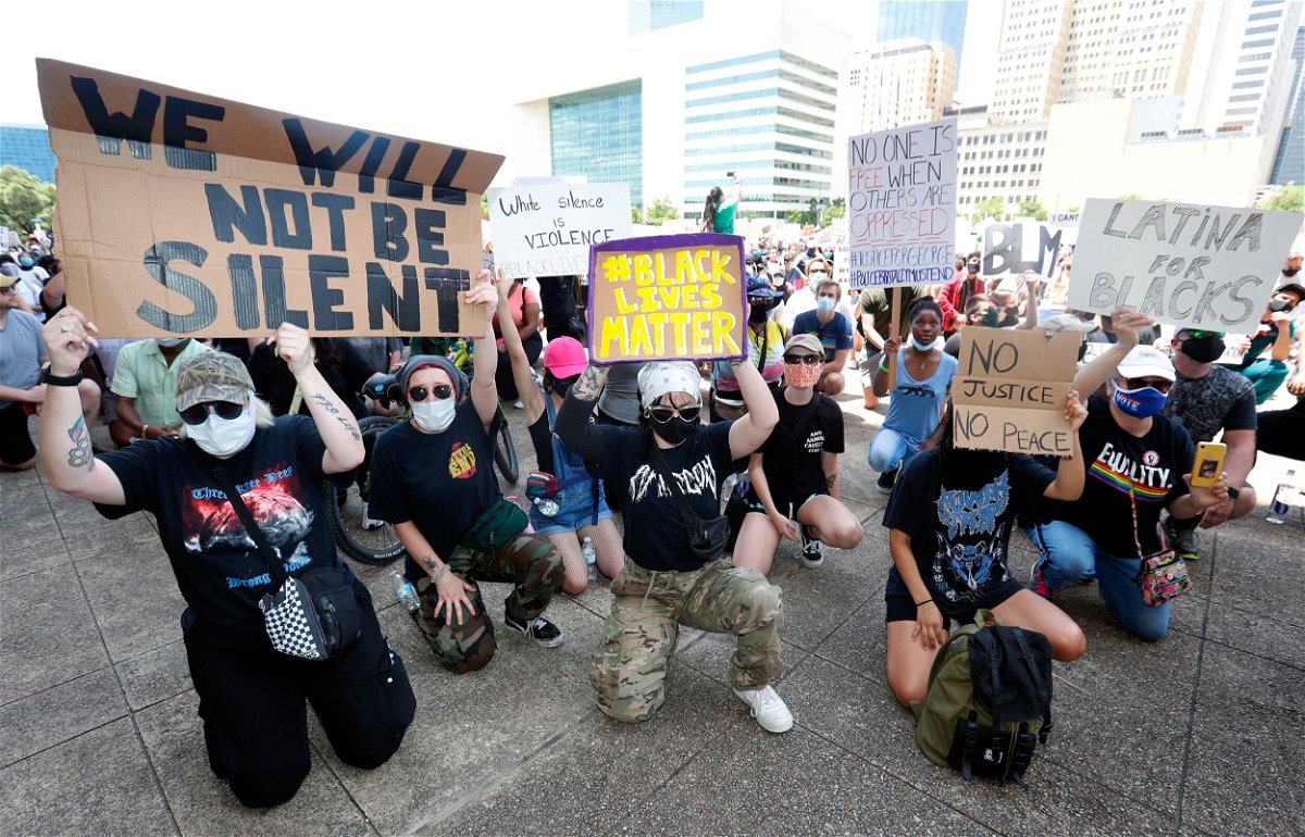 <i>LM Otero/AP</i><br/>Protesters take a knee to demonstrate in front of Dallas City Hall in downtown Dallas