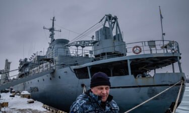 Ukrainian Navy Capt. Oleksandr Hrigorevskiy stands on the dock of Mariupol's port with his ship