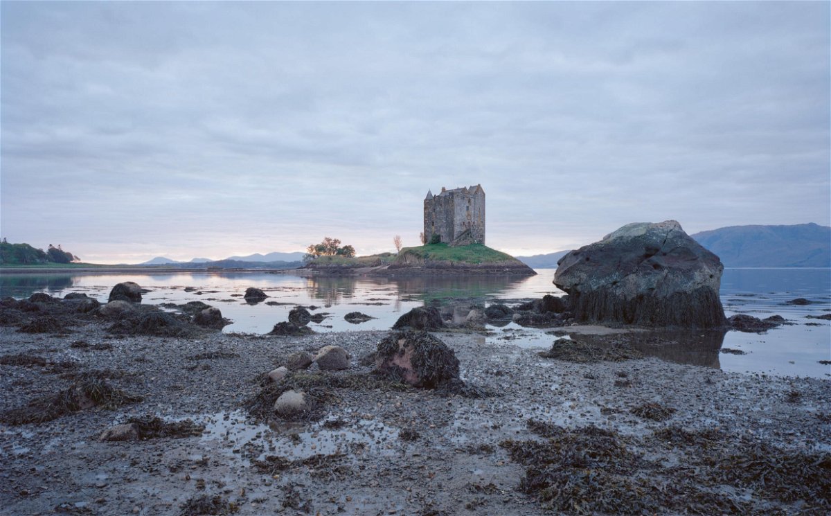 <i>Frédéric Chaubin/Courtesy of TASCHEN</i><br/>A view of the fortified Castle Stalker in Scotland