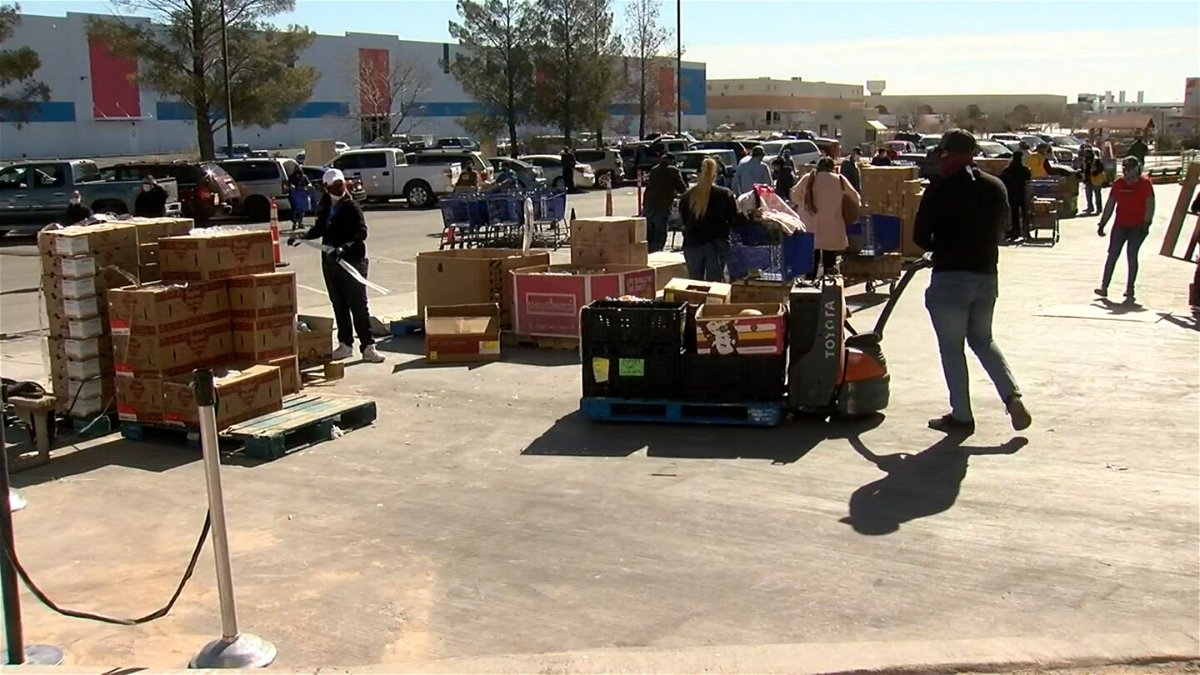 People picking up meals at the El Pasoans Fighting Hunger Food Bank in the lower valley.