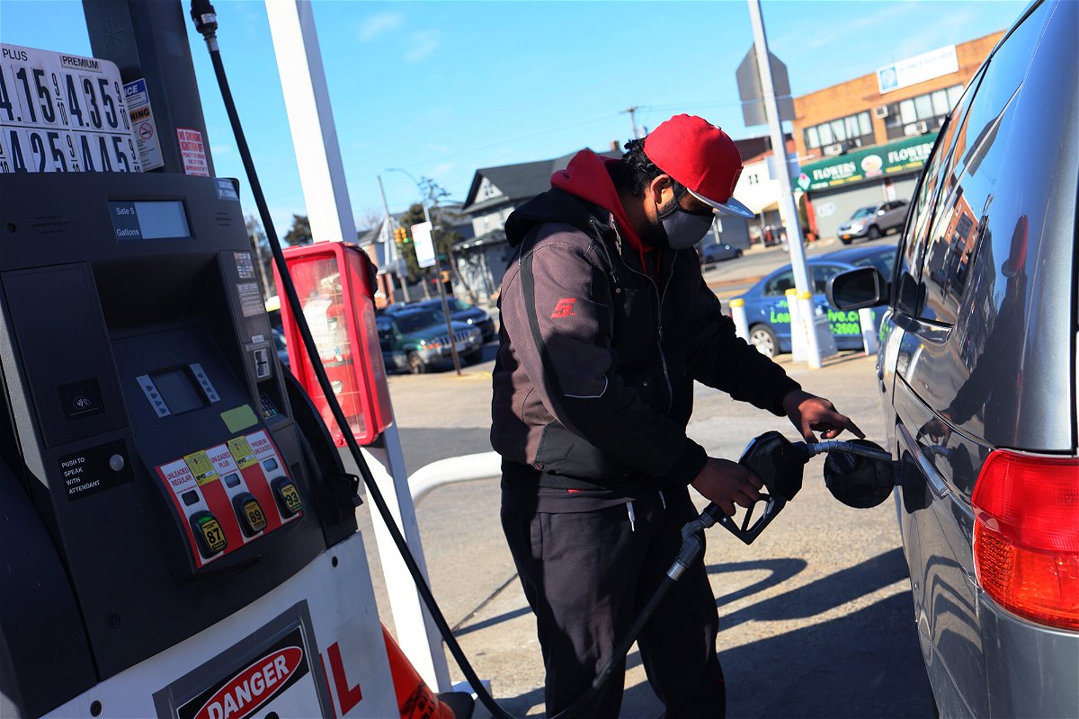 <i>Michael M. Santiago/Getty Images</i><br/>A Lukoil gas station attendant pumps gas in a customer's car on March 4 in the Canarsie neighborhood of Brooklyn in New York City.